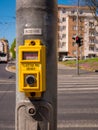 Pedestrian traffic light button for calling green walk sign.Translation of inscriptions: ÃÅEKEJTE = WAIT, TLAÃÅÃÂTKO PRO CHODCE Royalty Free Stock Photo